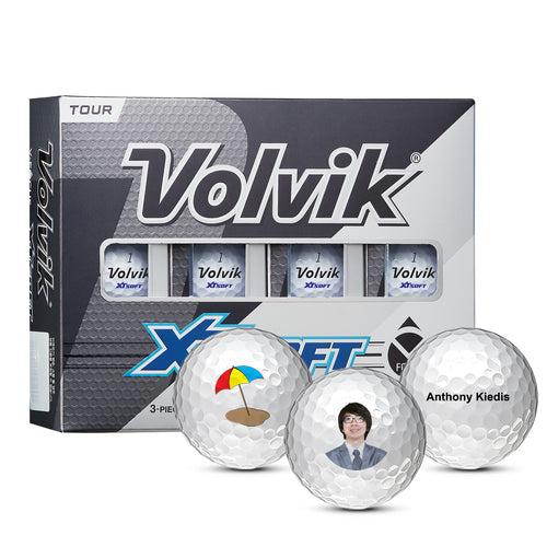 Box of Volvik XT golf balls with three custom balls in front.
