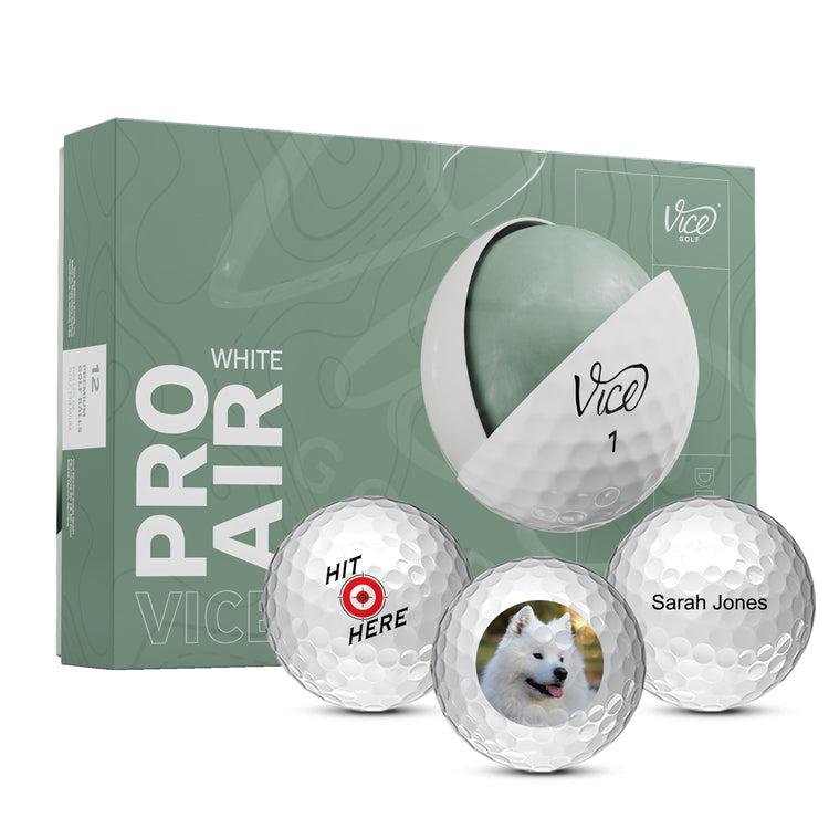 Box of Vice Pro Air golf balls with three custom golf balls in front