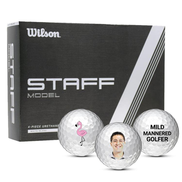 Box of Wilson Staff golf balls with three custom balls in front.